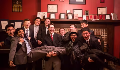 Beta Theta Pi brothers celebrating an award